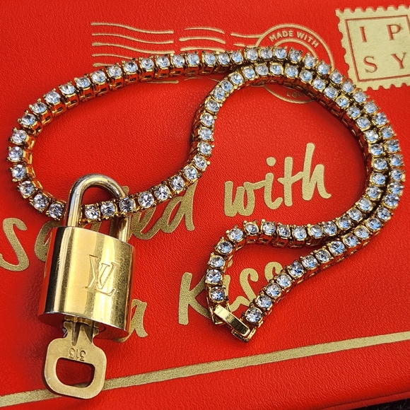 Louis Vuitton Accessories - Louis Vuitton Lock & Key, Unbranded Chain & IPSY Envelope Pouch Bundle